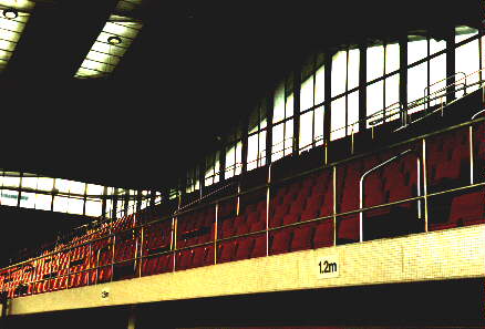 [Photo of poolside seating]