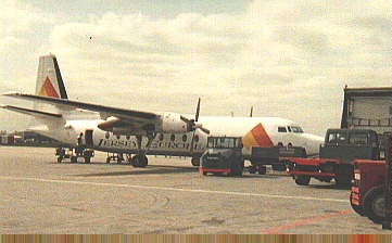 [Photo of plane at airport]
